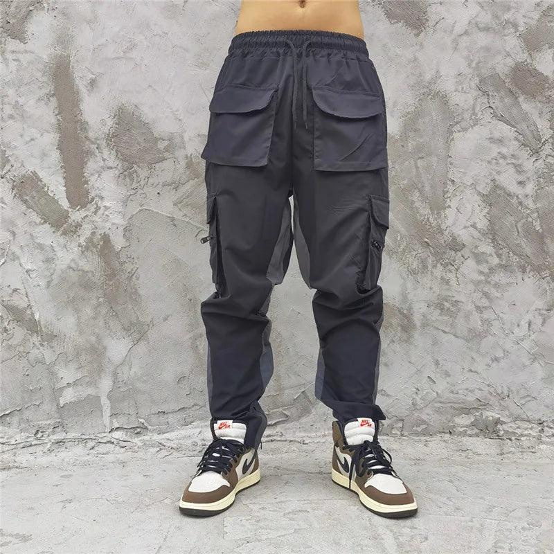 hip hop loose fit elastic waist pants cargo pockets spliced reflective lines ankle pants mens drewstring sportwear pants joggers unique joggers style 1969