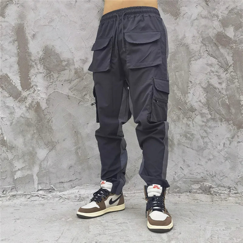 hip hop loose fit elastic waist pants cargo pockets spliced reflective lines ankle pants mens drewstring sportwear pants joggers unique joggers style 1968