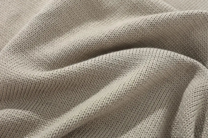 grunge knit sweater with heavyweight fabric, layered urban look for cold weather, street fashion menswear trend for seasonal 