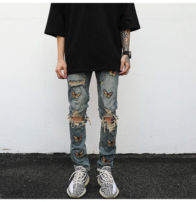 high street butterfly embroidery knee ripped hole jeans mens casual hip hop distressed jeans slim fit skinny denim pants joggers unique joggers style 1879