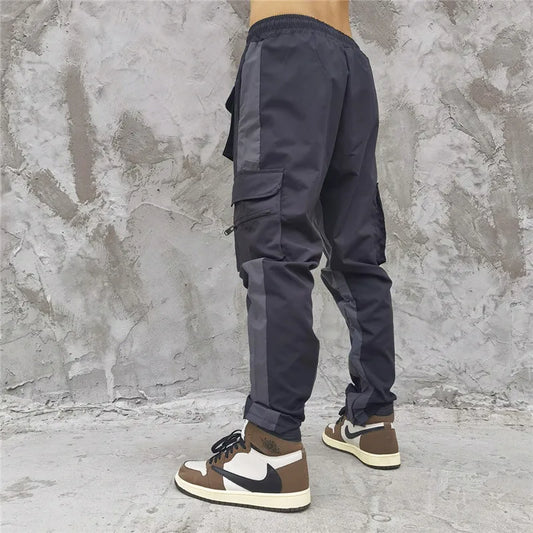 hip hop loose fit elastic waist pants cargo pockets spliced reflective lines ankle pants mens drewstring sportwear pants joggers casual joggers