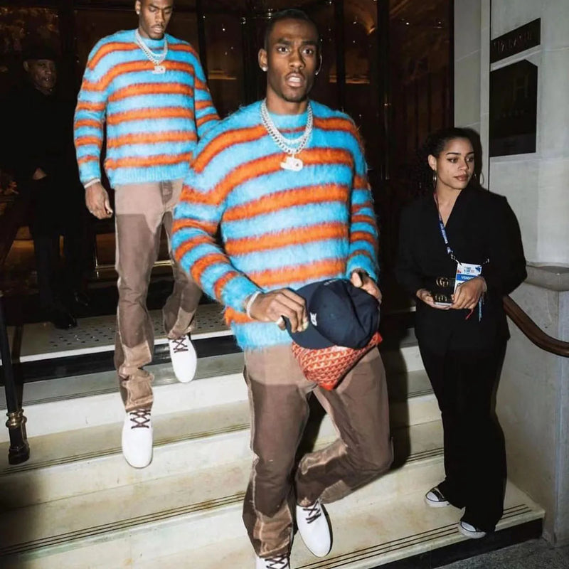 grunge knit sweater with heavyweight fabric, layered urban look for cold weather, street fashion menswear trend for seasonal 