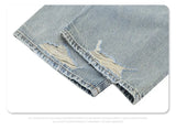 Straight Jeans with torn knees