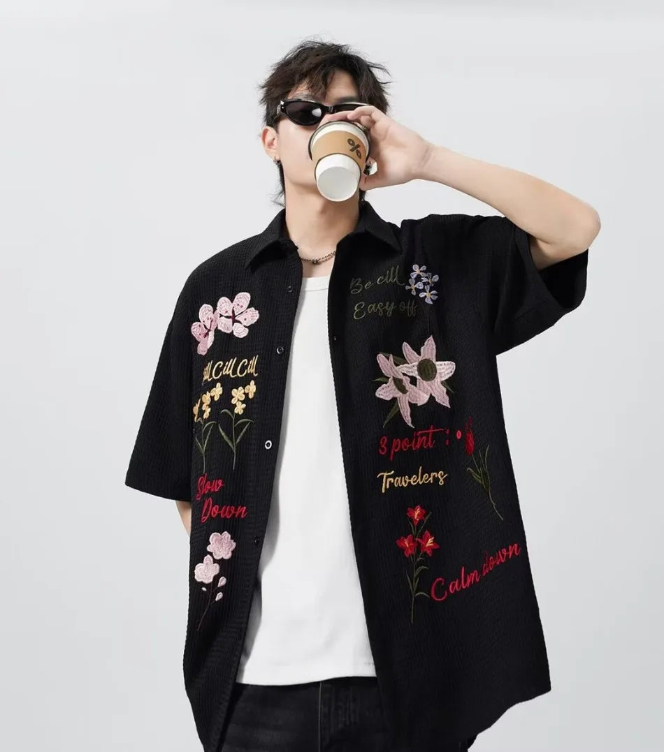 bold graphic coat, high-street look, for men, fall streetwear outfit, oversized style, layered fashion, modern aesthetic, graphic detail