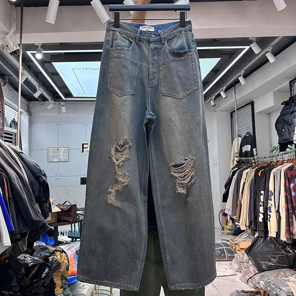 Cut Jeans with a mud-dye knife