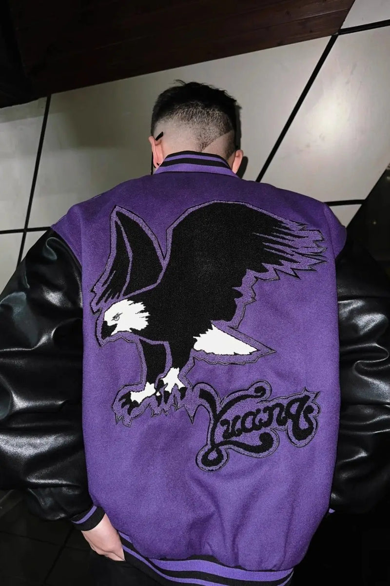 panel varsity outerwear, 2025 trend, for men, fall streetwear outfit, oversized style, layered fashion, modern aesthetic, graphic detail