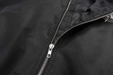 panel varsity outerwear, 2025 trend, for men, fall streetwear outfit, oversized style, layered fashion, modern aesthetic, graphic detail