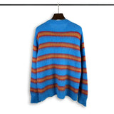 grunge knit sweater with heavyweight fabric, layered urban look for cold weather, street fashion menswear trend for seasonal 