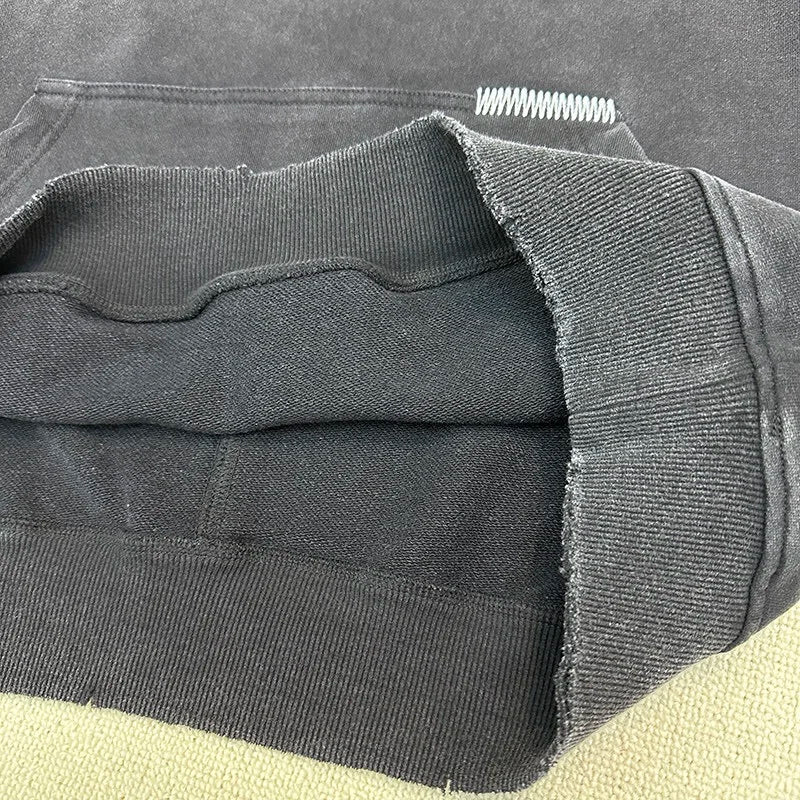 Urban gothic hoodie with cryptic symbols and eerie details