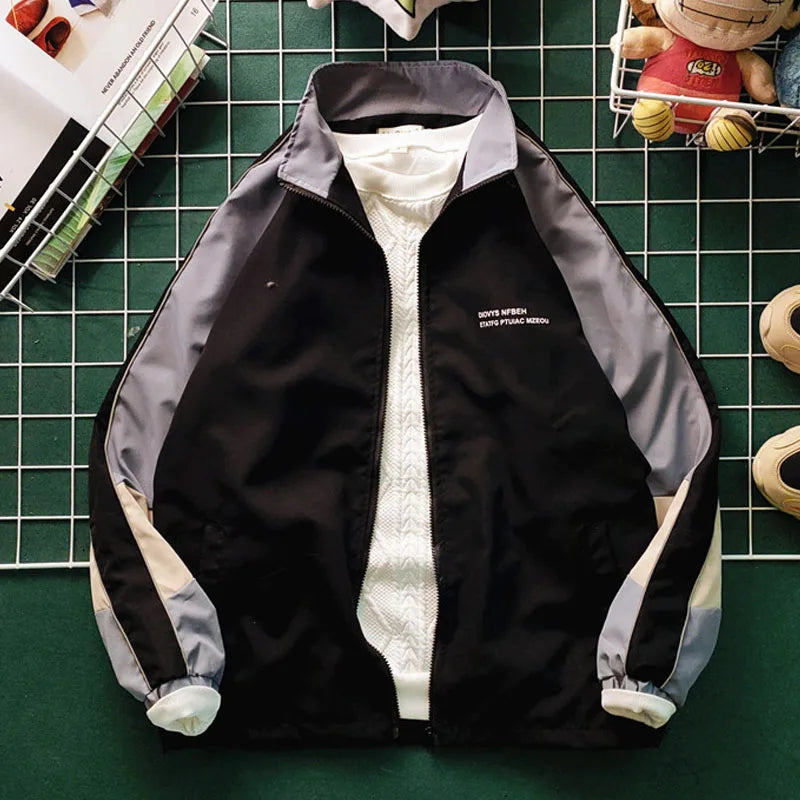 panel varsity outerwear, 2025 trend, for men, fall streetwear outfit, oversized style, layered fashion, modern aesthetic, graphic detail