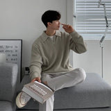 grunge knit sweater with heavyweight fabric, layered urban look for cold weather, street fashion menswear trend for seasonal 