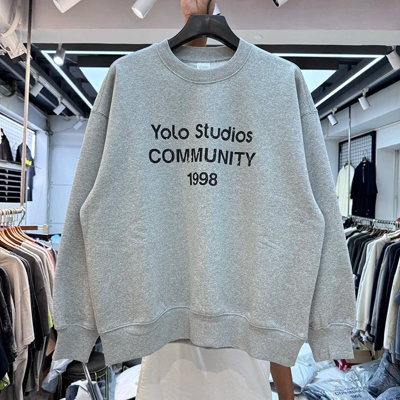 Gothic streetwear hoodie with black flame and cryptic text