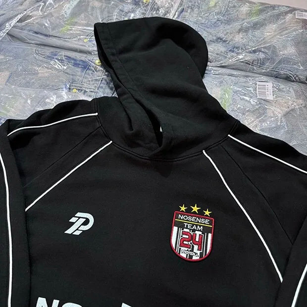 Color-blocked Y2K hoodie with anime-inspired design