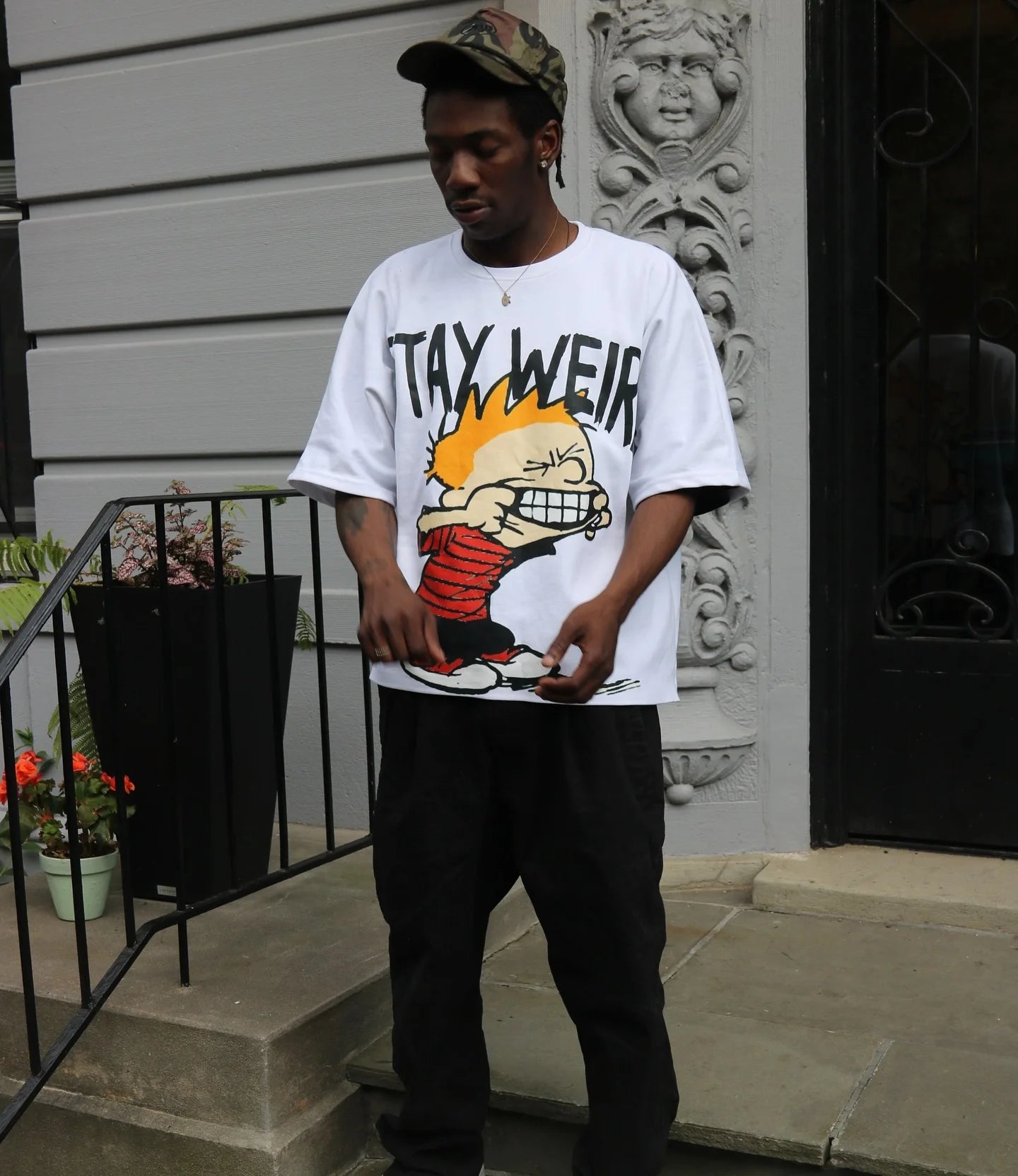 y2k oversized tee featuring layered comic flames and graffiti art