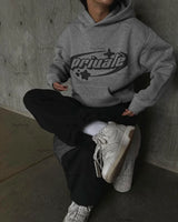 grunge knit sweater with heavyweight fabric, layered urban look for cold weather, street fashion menswear trend for seasonal 