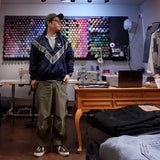 checkered varsity coat, layered streetwear look, trendy