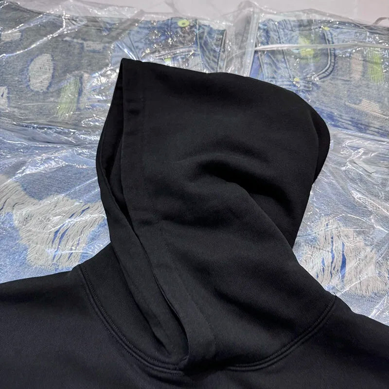 Gothic streetwear hoodie with skull and crossbones print