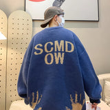 oversized flame jumper, 2025 fashion trend, fire knit jumper in oversized streetwear fashion