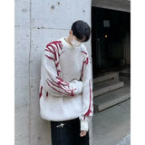 bold graphic pullover, layered streetwear look, soft knit pullover with flame design, y2k fashion statement