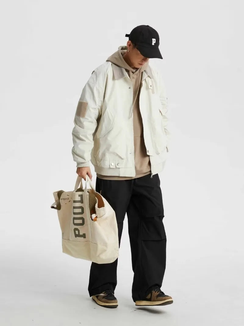 minimalist street zip-up, streetwear for men, fall streetwear outfit, oversized style, layered fashion, modern aesthetic, graphic detail