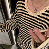 bold graphic pullover, layered streetwear look, soft knit pullover with flame design, y2k fashion statement