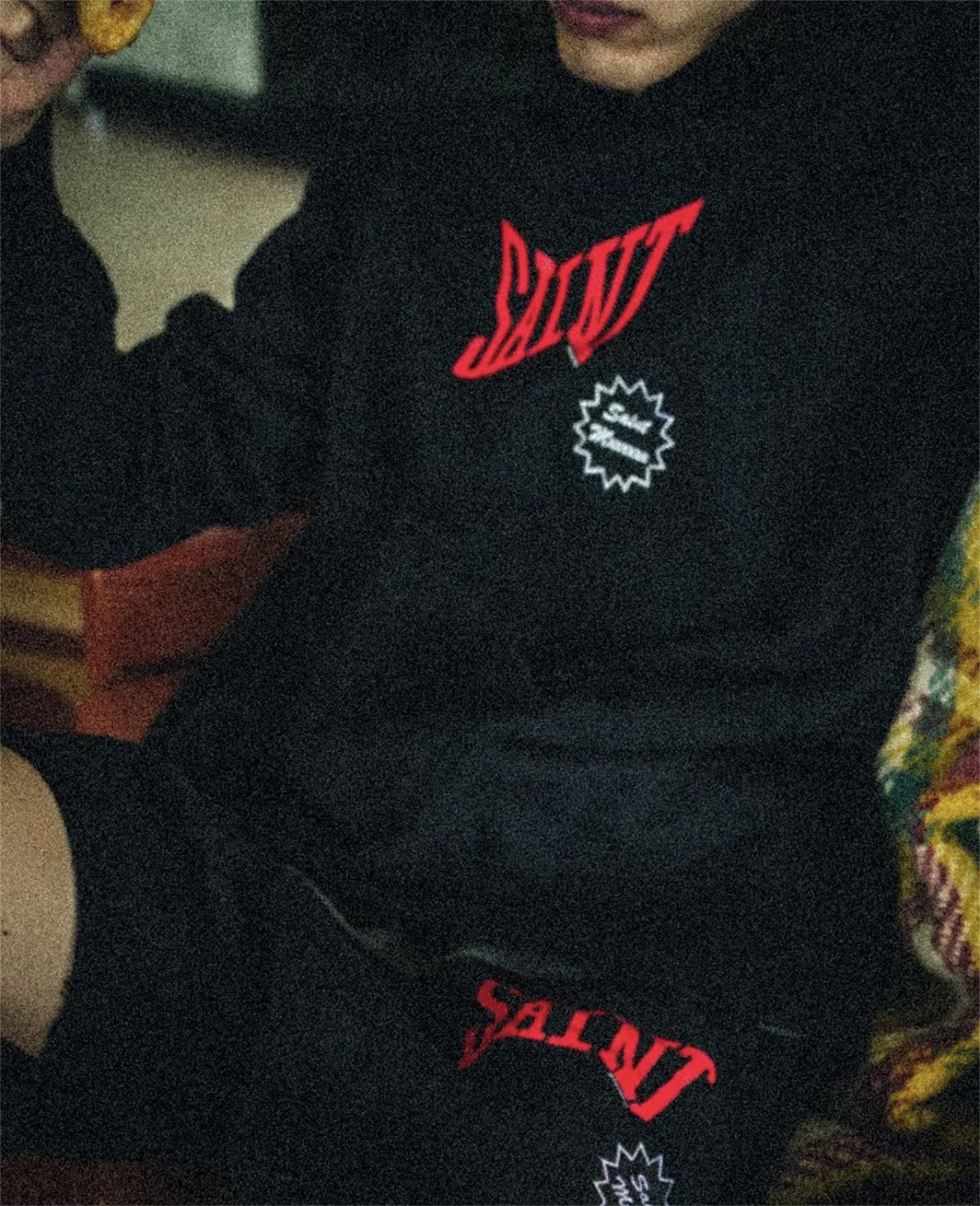 Skate streetwear hoodie with edgy spray-painted typography
