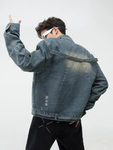 bold graphic coat, high-street look, for men, fall streetwear outfit, oversized style, layered fashion, modern aesthetic, graphic detail
