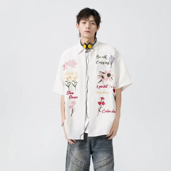 bold graphic coat, high-street look, for men, fall streetwear outfit, oversized style, layered fashion, modern aesthetic, graphic detail