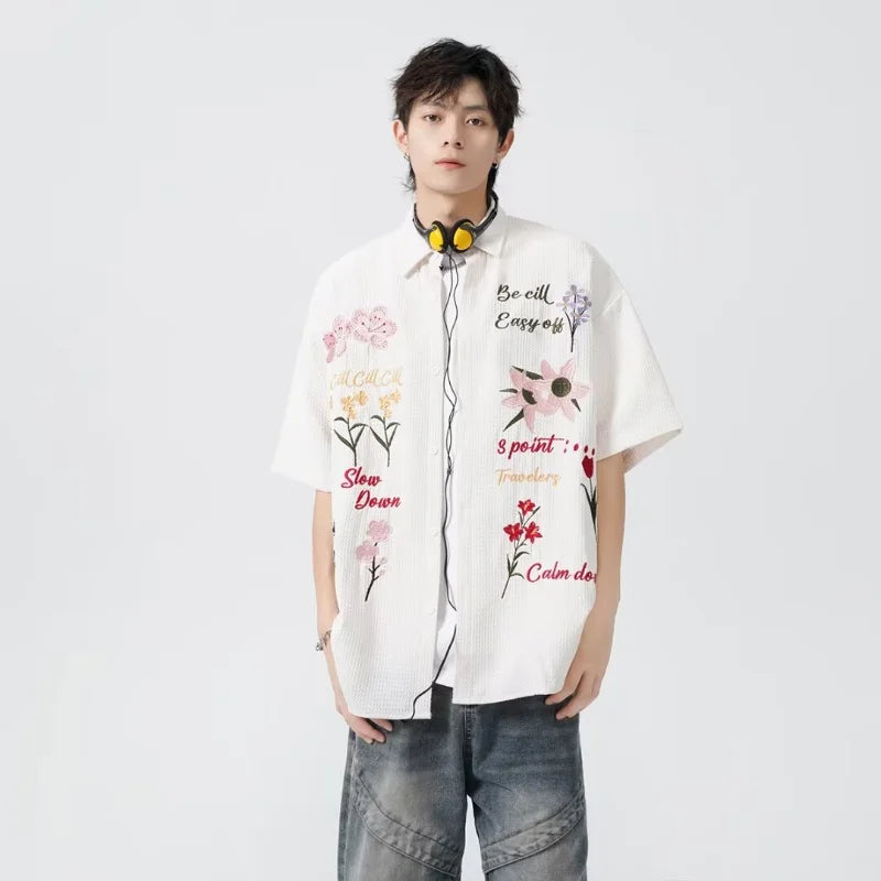 bold graphic coat, high-street look, for men, fall streetwear outfit, oversized style, layered fashion, modern aesthetic, graphic detail