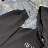 Skatercore hoodie with edgy graffiti-style artwork