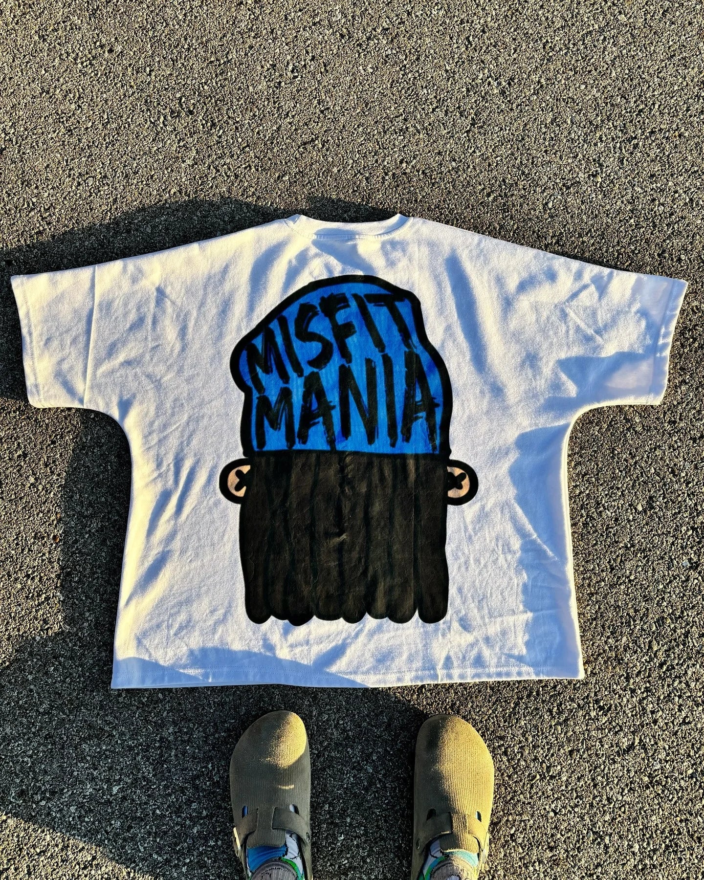 harajuku streetwear shirt with stylized anime distortion text