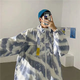 checkered varsity coat, layered streetwear look, trendy