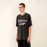 Y2K graphic t-shirt with flame text and pastel glitch overlay