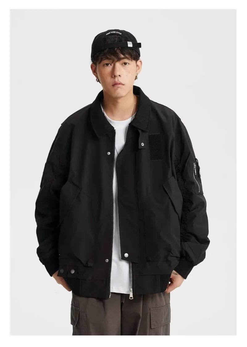 panel varsity outerwear, 2025 trend, for men, fall streetwear outfit, oversized style, layered fashion, modern aesthetic, graphic detail