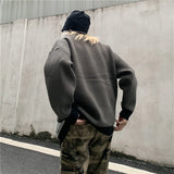 leather varsity jacket, layered cold look, cozy fashion fit, stylish street outfit, modern aesthetic appeal
