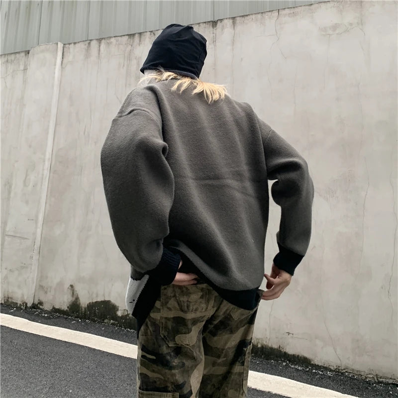leather varsity jacket, layered cold look, cozy fashion fit, stylish street outfit, modern aesthetic appeal