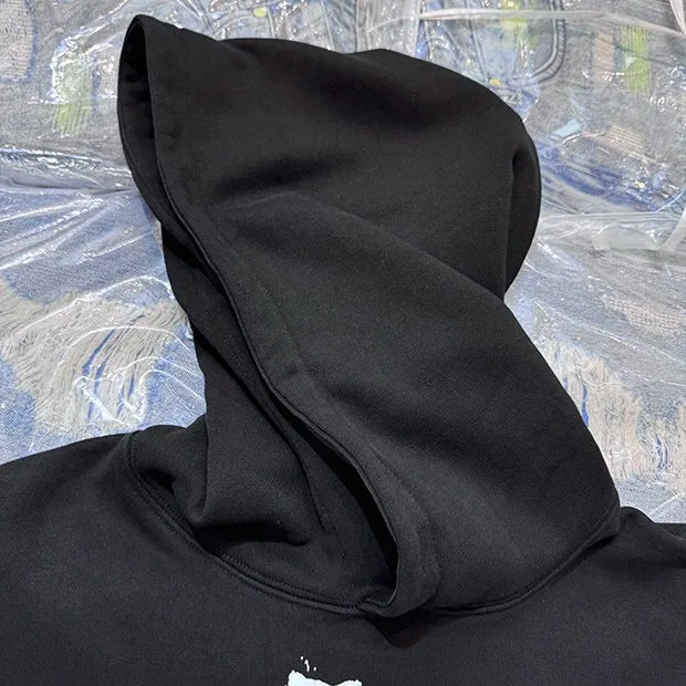Skatepark hoodie with rebellious DIY-style graphics
