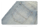 Straight Jeans with torn knees