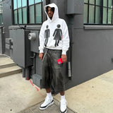 Baggy Y2K hoodie with nostalgic graffiti artwork