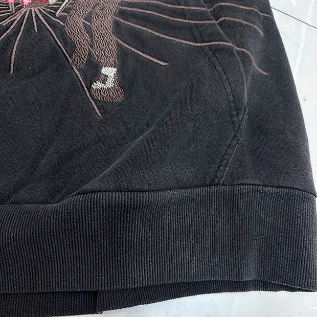 Vintage 2000s-style hoodie with bold comic book graphics