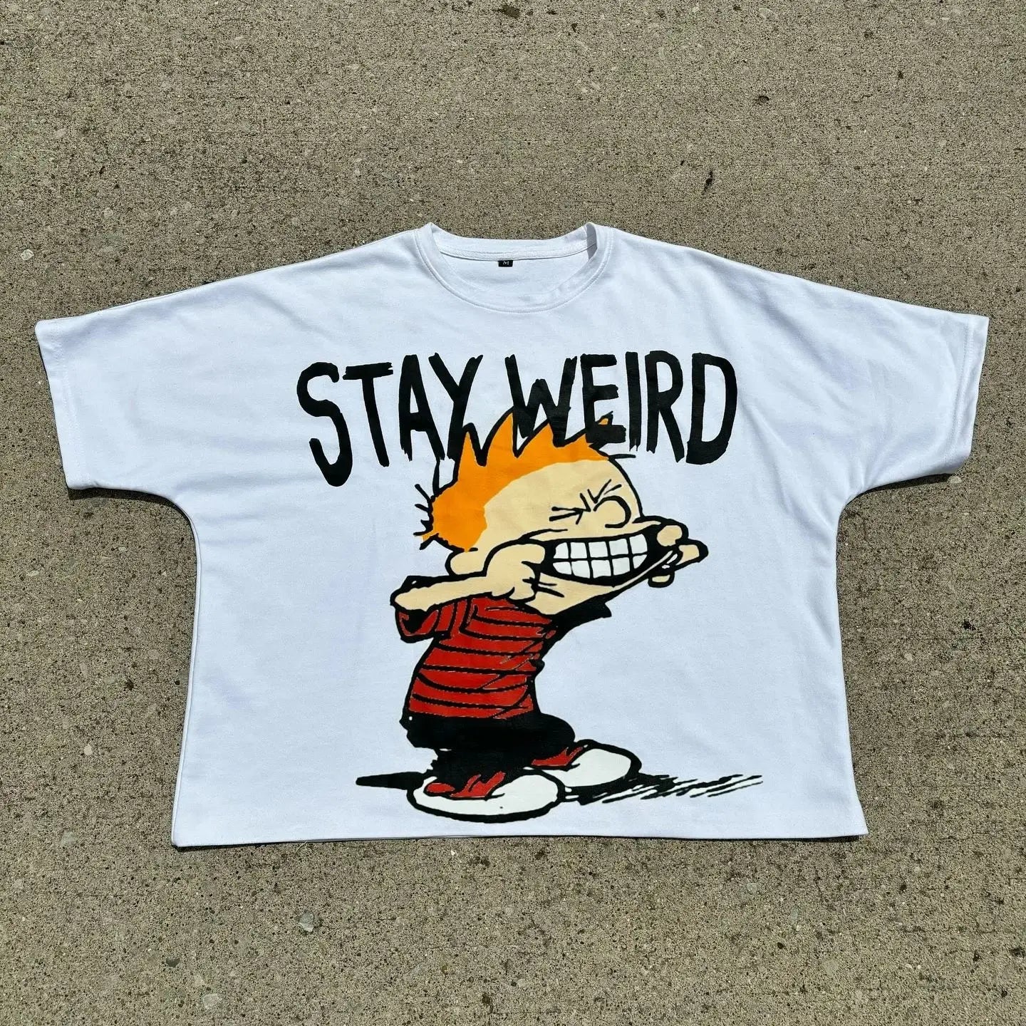 manga-inspired streetwear tee with broken text and shadow print