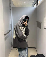 Trap culture hoodie with luxury branding elements