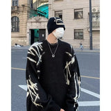 bold graphic pullover, layered streetwear look, soft knit pullover with flame design, y2k fashion statement