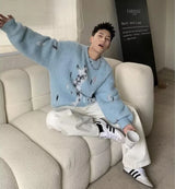 bold graphic pullover, layered streetwear look, soft knit pullover with flame design, y2k fashion statement