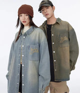 bold graphic coat, high-street look, for men, fall streetwear outfit, oversized style, layered fashion, modern aesthetic, graphic detail