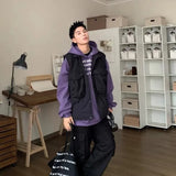 panel varsity outerwear, 2025 trend, for men, fall streetwear outfit, oversized style, layered fashion, modern aesthetic, graphic detail