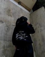 Neon pink and blue Y2K hoodie with aesthetic graphics
