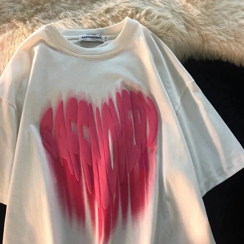 urban oversized t-shirt featuring layered anime graffiti panels