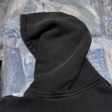 Alternative fashion hoodie with distressed dark graphics