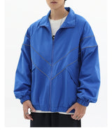panel varsity outerwear, 2025 trend, for men, fall streetwear outfit, oversized style, layered fashion, modern aesthetic, graphic detail